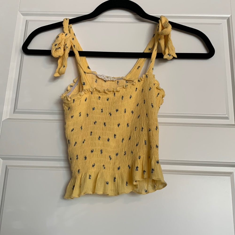 Yellow flowy tank top with small blue flowers size XS
